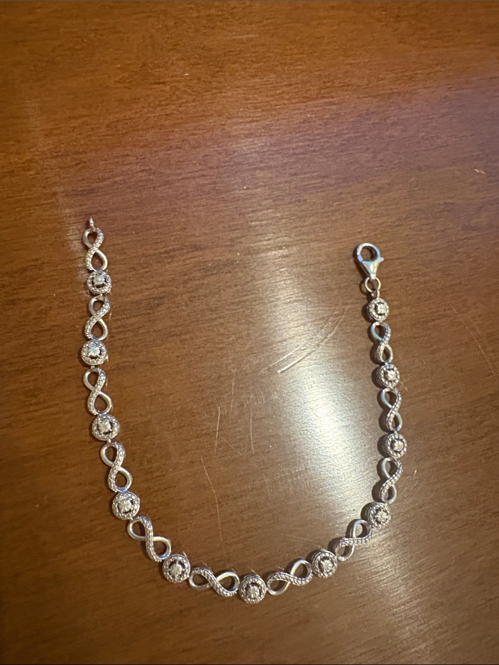Elegant Silver Infinity Bracelet with Round Cubic Zirconia Accents